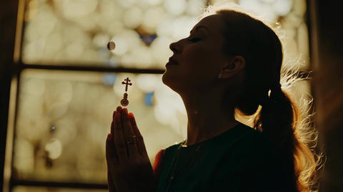 Woman Praying with Rosary