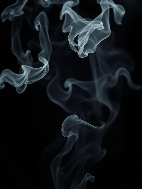 Steam or smoke on a black background copy space Smoke Explosion Backdrop
