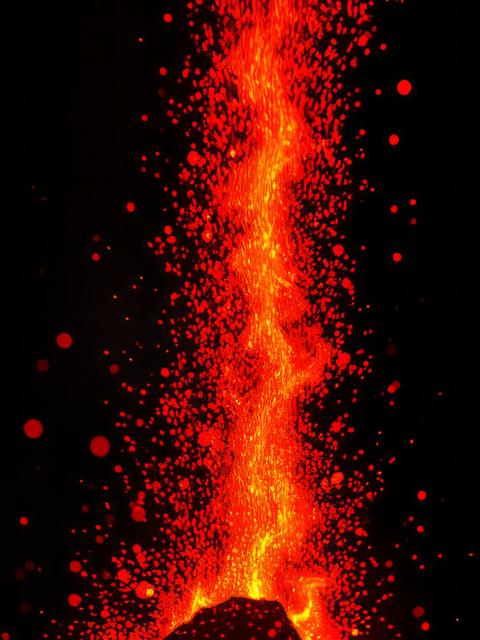 Burning red hot sparks rise from large fire in the night fire flames sparks background abstract dark