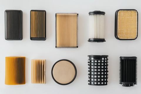 A variety of automotive filters are displayed, showcasing different designs for