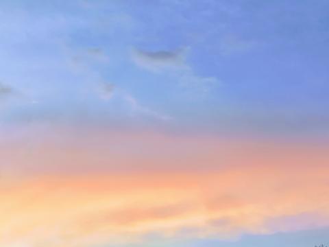 the sky is blue, purple and orange in the afternoon