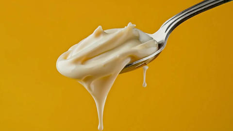 Mayonnaise sauce on a spoon