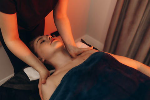Hands, massage and face of woman for relax, beauty and treatment for client on