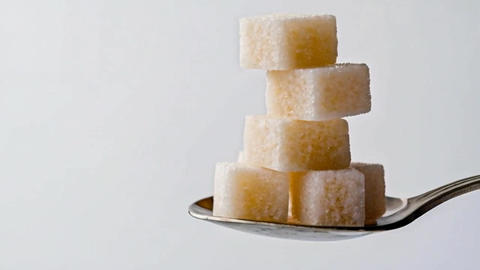 Sugar cubes on a spoon