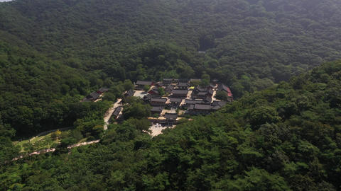 Korean temple buildings visible across mountainous terrain