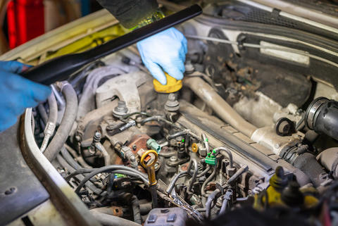 dismantled car engine in a car workshop