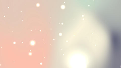 Blurry light pastel background with glowing particles