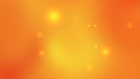 Orange background features small bright yellow glowing circles