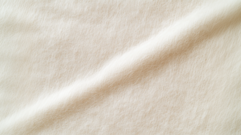 White wool fabric texture with diagonal fold, soft textile background, seamless pattern