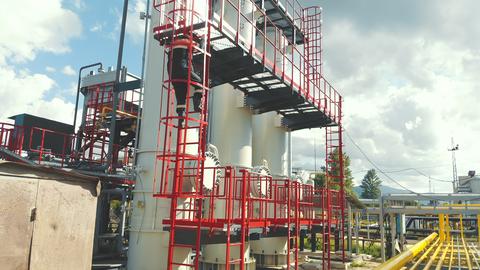 Aerial view gas station operator descends from the top of the station. Modern gas complex in the