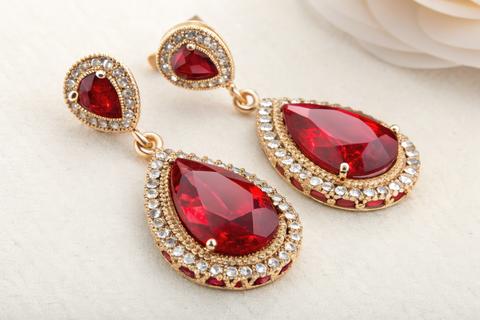 Elegant Earrings With Large Red Stone and Intricate Design Generative AI