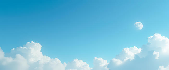 Moon Rising Behind Clouds in Clear Blue Sky