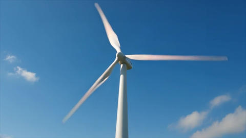 Wind turbine against clear blue sky, renewable energy, eco-friendly power generation
