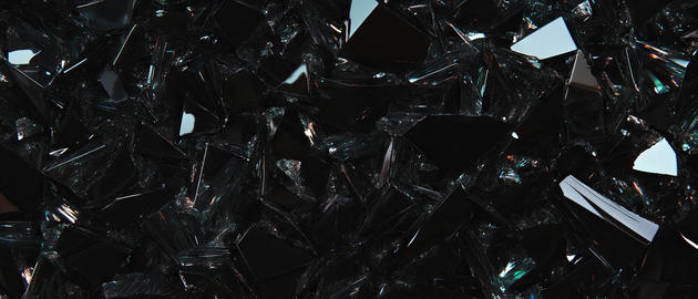 Rough broken glass texture on a black background with space for logo design