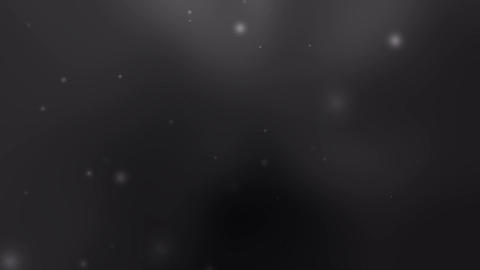 black grey background features small bright particles softly glowing