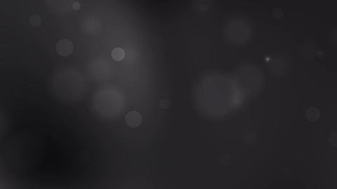 black gray background with small bright blurry specks