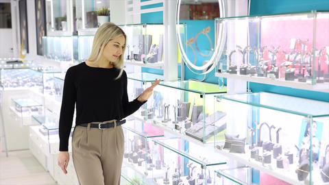 Saleswoman showing jewelry in a jewelry store