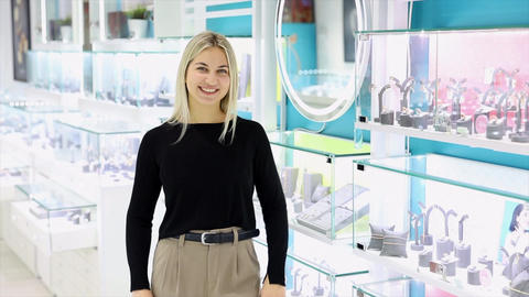 Saleswoman showing jewelry in a jewelry store