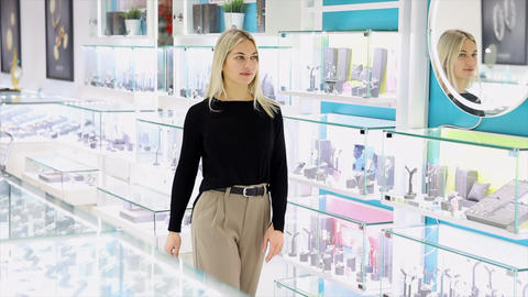 Saleswoman showing jewelry in a jewelry store
