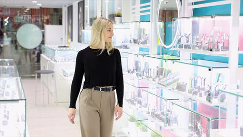 Saleswoman showing jewelry in a jewelry store