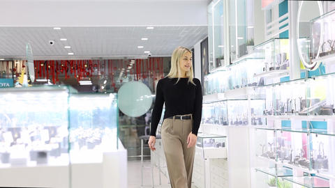 Saleswoman showing jewelry in a jewelry store