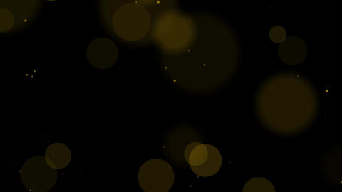 Golden bokeh light particles on deep black background Luxurious and elegant glitter effect