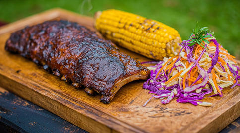 smoked pork ribs with corn and coleslaw