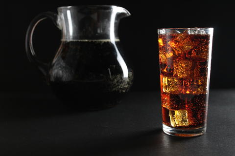 kvass drink in a dark low key kvass drink in an iced glass and a jug with a drink with room for text