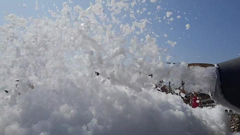 A foam generator pumps up a cloud of foam