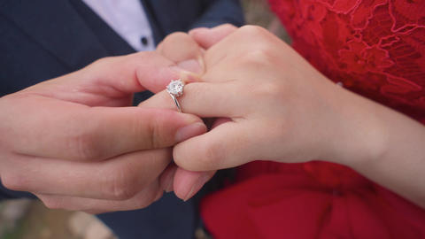 Hand with a ring. Put the ring on your finger