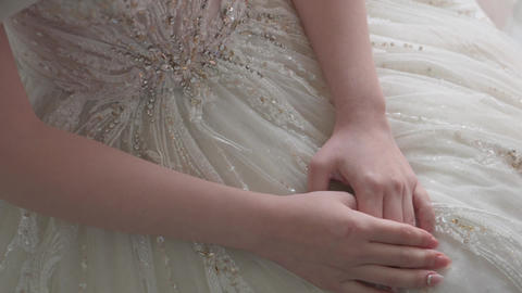 Wedding dress, female hands, bride's hands