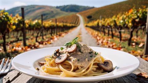 Creamy Tagliatelle With Mushrooms On Rustic Table, Vineyard Lane And Fallen Leaves Glowing In