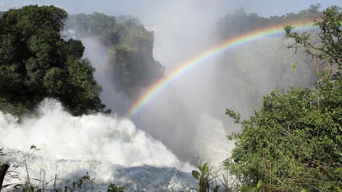 Zimbabwe Victoria Falls. Wide view, water spray. Scenic African wonder, river gorge