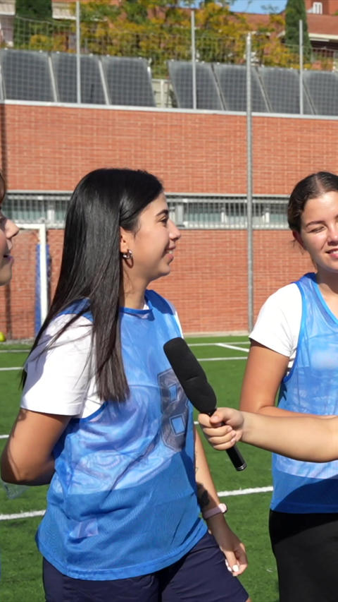Female soccer players team giving interview after match