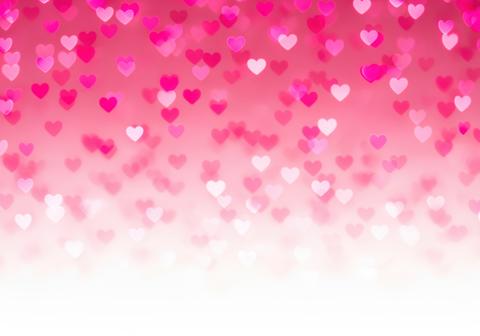 Romantic pink and magenta heart bokeh lights texture on a soft gradient background