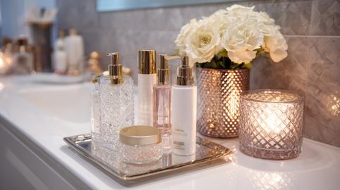 Modern Bathroom Counter Displays Luxury Skincare Collection With Elegant Decor