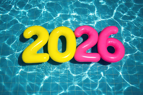 Colorful 2026 numbers float in a swimming pool
