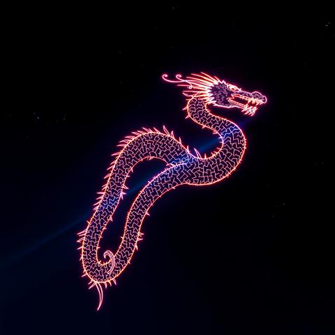 Spectacular drone light show forms a captivating dragon shape against a starry night sky