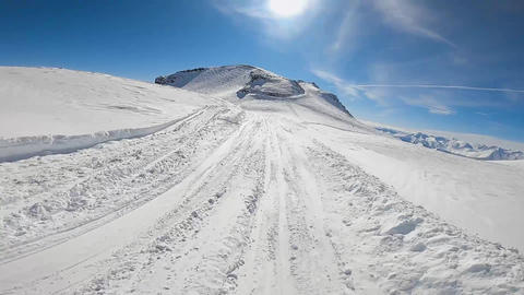 Skier riding on slope using sticks