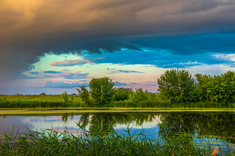 Picturesque view of the landscape in a non-urban area. Rain clouds over river