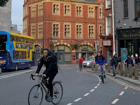 Dublin, Ireland, October 22, 2019 Dublin street scene with cyclists, blue-yellow double