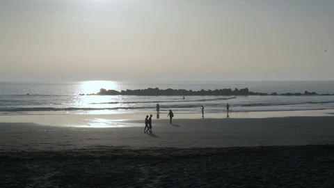 walking on the beach on sunset