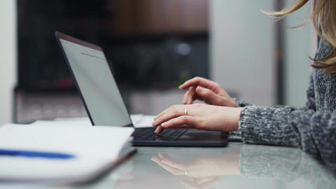 Woman hands typing on laptop keyboard