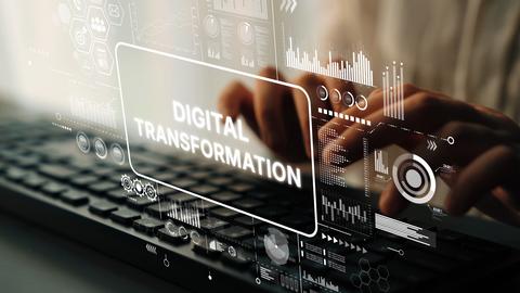 Digital Transformation Concept with Hands on Keyboard and Futuristic Data