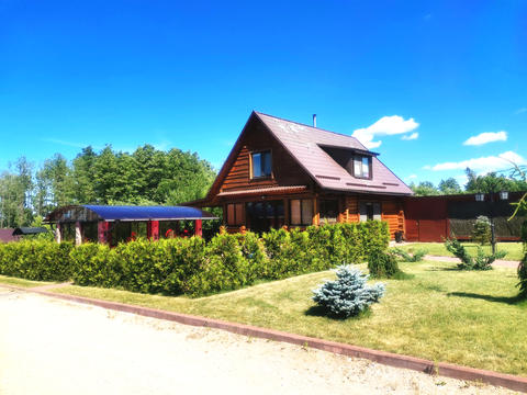 Wooden country house with private grounds