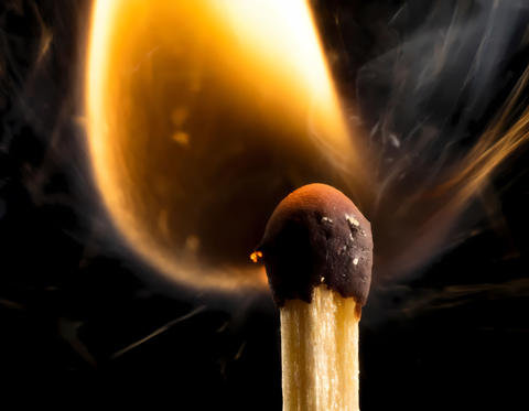 macro photo of a burning match