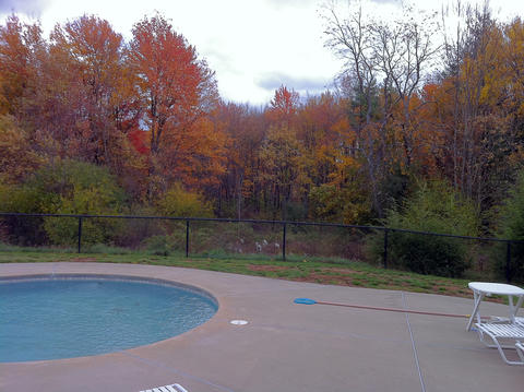 A Pool With A Fence Surrounding It