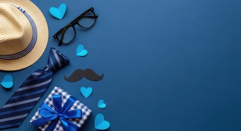 Father's day gifts and accessories on dark blue background with copy space