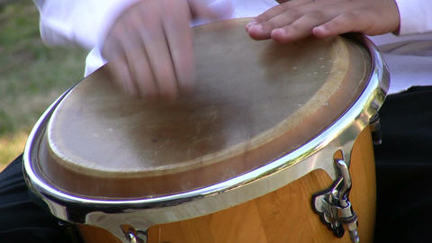 Drumming on conga drum 1