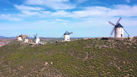 Aerial Pullback from Consuegra Windmills Revealing Historic Town – Don Quixote Landscape, Spain